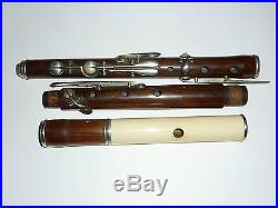 Antique Figured rosewood flute possibly German along with similar piccolo