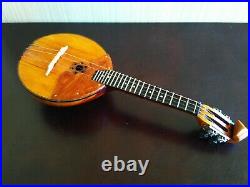 Domra piccolo Folklore instrument. Balalaika. Ukrainian, Russian folk instrument