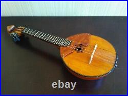 Domra piccolo Folklore instrument. Balalaika. Ukrainian, Russian folk instrument