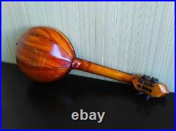 Domra piccolo Folklore instrument. Balalaika. Ukrainian, Russian folk instrument