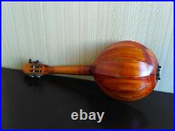 Domra piccolo Folklore instrument. Balalaika. Ukrainian, Russian folk instrument