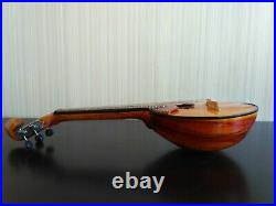 Domra piccolo Folklore instrument. Balalaika. Ukrainian, Russian folk instrument