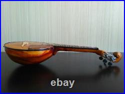 Domra piccolo Folklore instrument. Balalaika. Ukrainian, Russian folk instrument