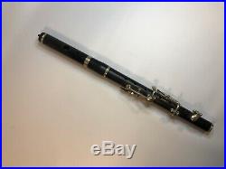 Old antique piccolo flute. Fife. Wooden. 6 keys