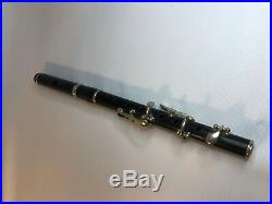 Old antique piccolo flute. Fife. Wooden. 6 keys